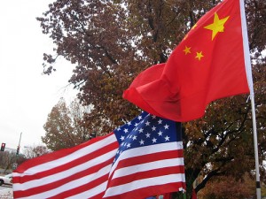 Chinese and American flags flying together